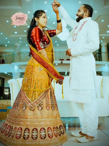 A candid, happy moment. The bride's reception hairstyle and makeup are designed to be comfortable and stay perfect even while dancing.