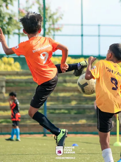 A moment of pure athletic skill as a player connects with the ball mid-air. My league is filled with these displays of talent and determination from young football players.