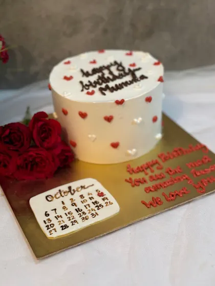 A sweet birthday cake with a calendar marking a special day in October. A thoughtful and personalized design.