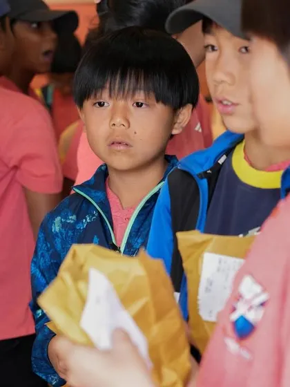 Young players sharing their chocolate finds with each other.