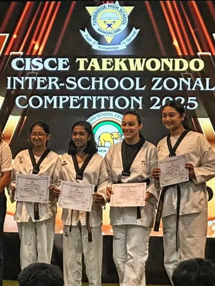 My female students proudly displaying their certificates and medals after a successful CISCE Inter-School Zonal Competition.