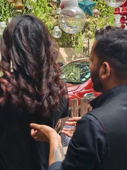 A stylist consulting with a male client about his new look. I believe in a collaborative approach to ensure the final result is exactly what you envisioned.
