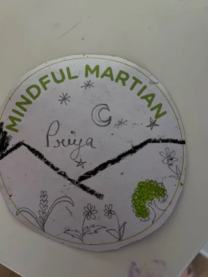 Our instructor Priya also made her own "Mindful Martian" badge! We believe in participating alongside the kids to foster a connected and encouraging environment.