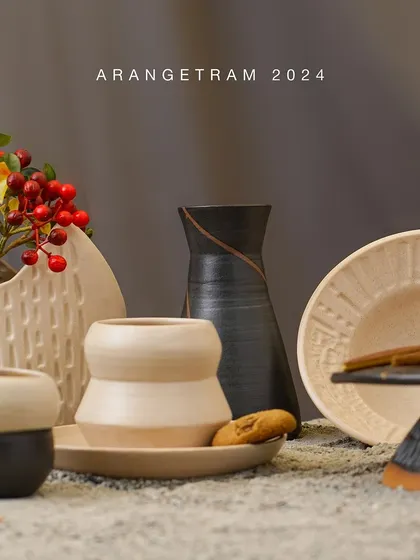 Akanksha, an e-commerce entrepreneur turned pottery enthusiast, presents her debut collection "Finding Balance" at Arangetram. Her work explores the harmony between structure and spontaneity, using contrasting colors and textures to symbolize how order and chaos coexist.