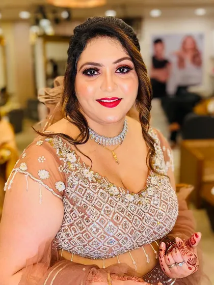 A beautiful portrait of the client. Her makeup is polished and elegant, enhancing her features for a special occasion.