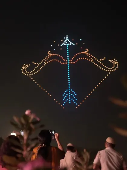 A bow and arrow formation from our Dilli Deepotsav show, symbolizing the victory of Lord Ram. The crowd watches, capturing the moment where mythology and technology meet.