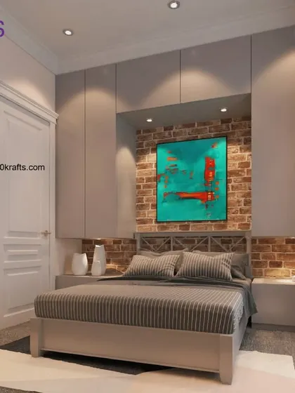 The bedroom in our 'American Industrial' villa. An exposed brick wall niche behind the bed adds a raw, textural element, beautifully contrasted with the sleek grey built-in wardrobes.