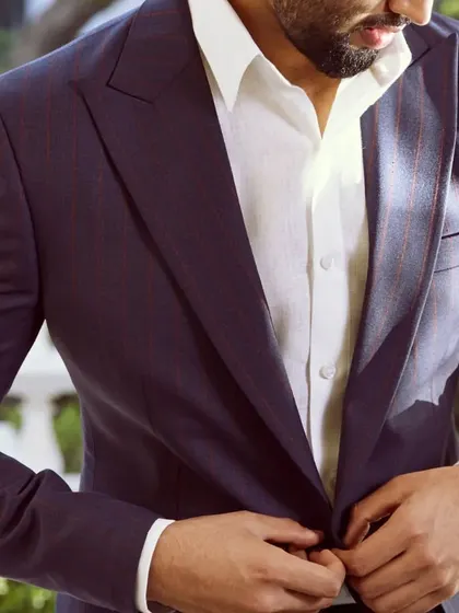 This wine-striped linen jacket is the perfect ensemble for your summer formals, paired with a classic white shirt.