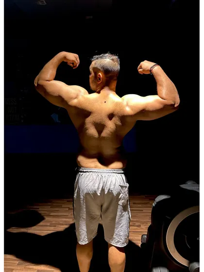 I practice what I preach. Building a strong, defined back requires dedication and the right exercises. This is the physique built by years of discipline and heavy lifting.