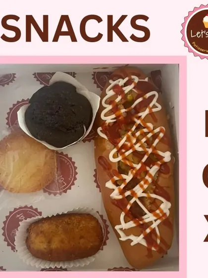 This party snack box includes a hot dog, a chocolate muffin, a cookie, and a croquette, providing a satisfying and delicious selection for any gathering.