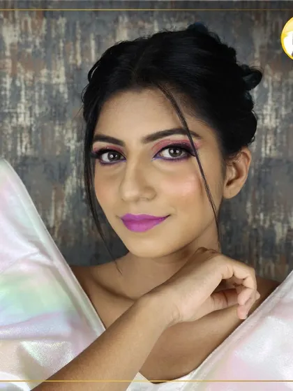 This look, created for a cocktail party demonstration, features a bright purple lip and a complementary shimmery eye. I teach how to confidently pair bold colors for a fun and modern result.