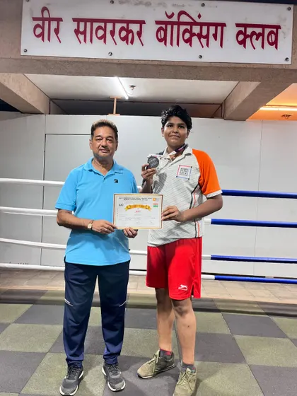 Another proud moment with my boxer Jagruti, celebrating her win with a medal and certificate. We document every achievement as part of our club's legacy.