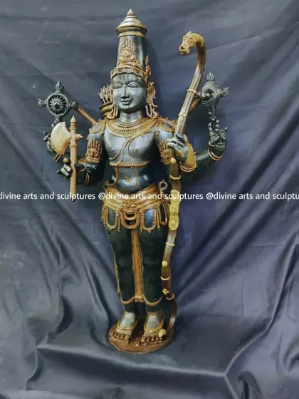 This wax model depicts Parashurama, the sixth avatar of Lord Vishnu, known for his skill as a warrior. He is shown here with his characteristic axe and bow, ready to uphold dharma.