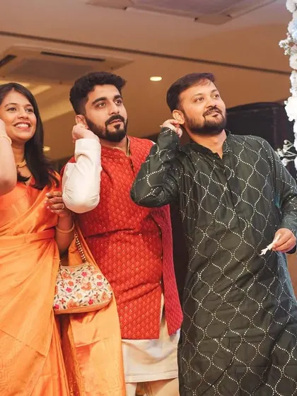The guests' reactions are a big part of the story. Here, friends and family watch the ceremony with anticipation and joy.