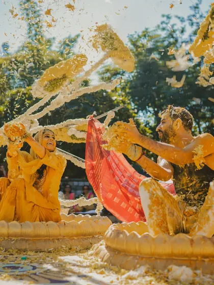 Weddings are about vibrant, uninhibited fun. This shot from a Haldi ceremony captures the playful chaos and energy that make pre-wedding rituals so memorable. I focus on capturing the action as it happens, full of life and color.