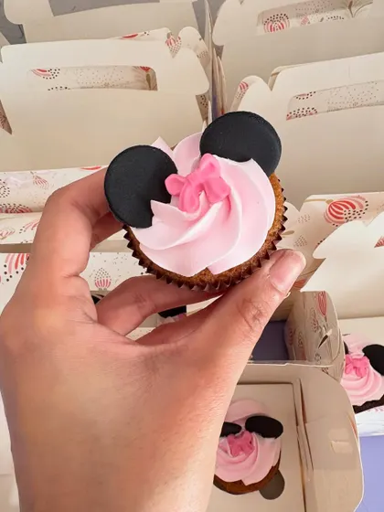 A classic Minnie Mouse cupcake, complete with her signature ears and a little pink bow. These are always a popular choice for Disney-themed parties.
