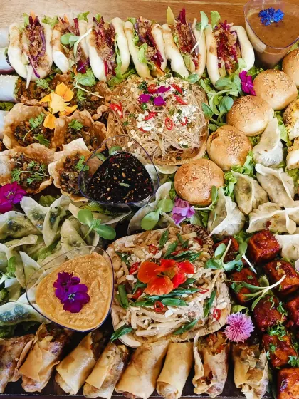 Our Pan Asian Platter brings rolls, buns and little party bites together around dips, vegetables and flowers.