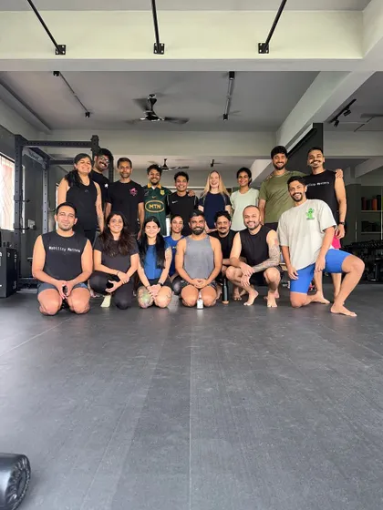 The Troop HQ community celebrating our one-year anniversary after a challenging mobility workshop. This space has become a second home for so many of us.