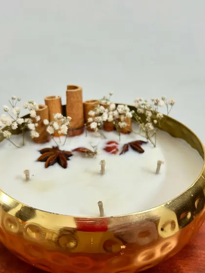 My 6-inch premium metal urli, unlit, showing the beautiful arrangement of dried flowers and spices. It's a stunning decor piece even before it's lit.