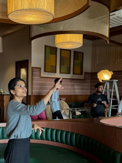 Here, our co-founder Manuni Patel is on-site at the Eat Punjab restaurant, overseeing the installation of the custom lighting. Her attention to detail and hands-on approach ensure that our design vision is executed with precision and care.
