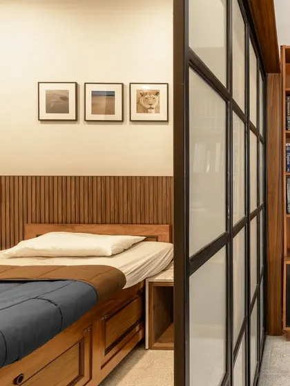 This before-and-after sequence shows how we reimagined a large, cluttered bedroom. By introducing a sliding partition and custom joinery, we created a multi-functional master suite with a cozy sleeping area, a wardrobe, and a bright study space, optimizing every inch of the room.