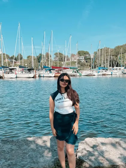 A summer day in Toronto, posing in front of the sailboats at the marina.