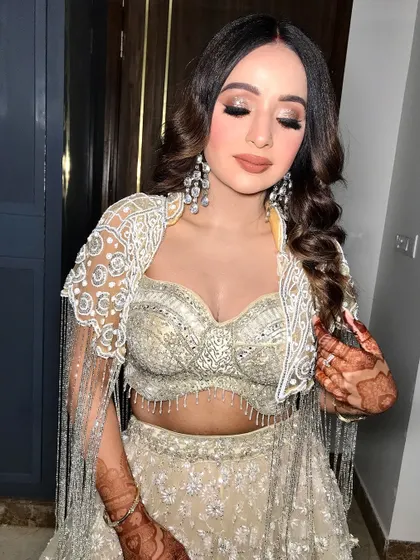 Eyes closed, highlighting the stunning glittery eyeshadow.