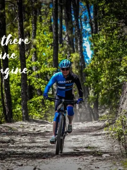 A rider enjoying a solo moment on a forest trail near Nainital. In cycling, you are the engine, and the mountains are your playground.
