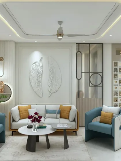 This living room features a statement wall with two large, white feather-like sculptures. The blue and yellow cushions add a vibrant pop of color to the otherwise neutral space.