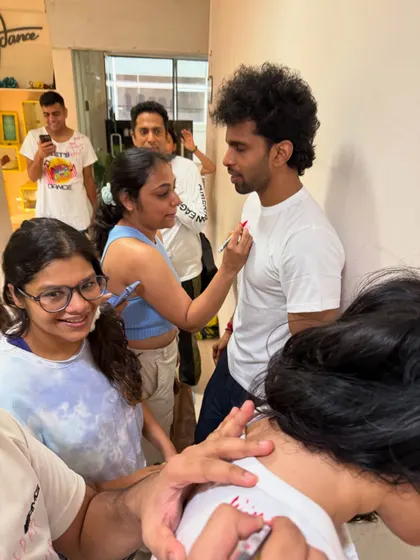 The concentration is real. A student carefully writing a roast on her friend's t shirt. This event was one for the LDI diaries.