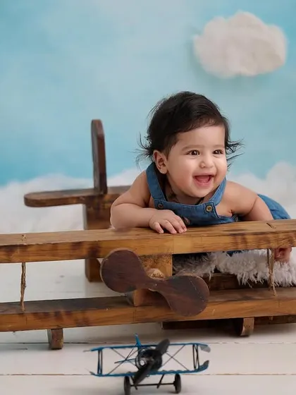 The joy of flight. This little pilot's happy laugh makes our aviator-themed shoot even more special.