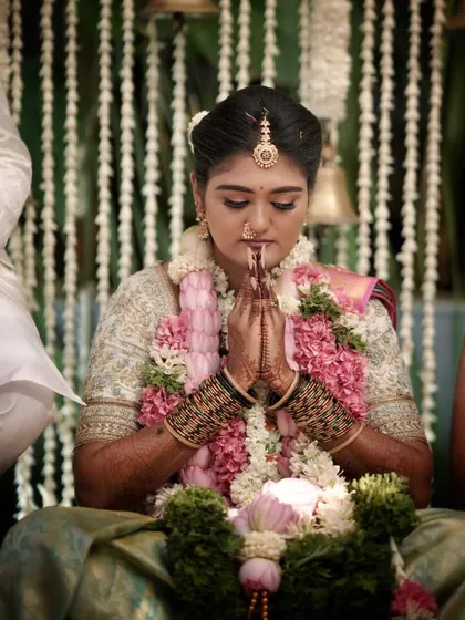 A candid moment during the ceremony. The makeup is designed to withstand the emotions and rituals of the day, keeping the bride looking perfect.