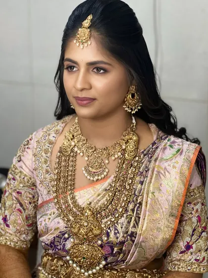 This bride looks effortlessly elegant. The makeup is understated yet polished, a testament to the "less is more" philosophy that I teach for achieving sophisticated looks.