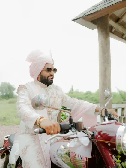 The Baraat is pure energy. The groom's grand entrance on a Bullet, surrounded by his crew, is the kind of stylish, high-energy moment that kicks off the celebration.