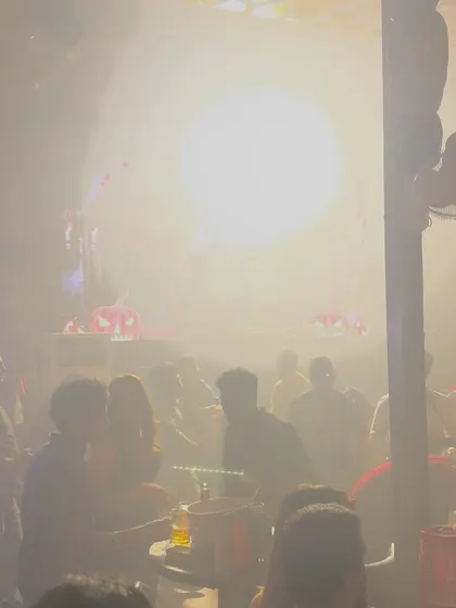 A smoky, atmospheric shot of the dance floor, capturing the club's energy.
