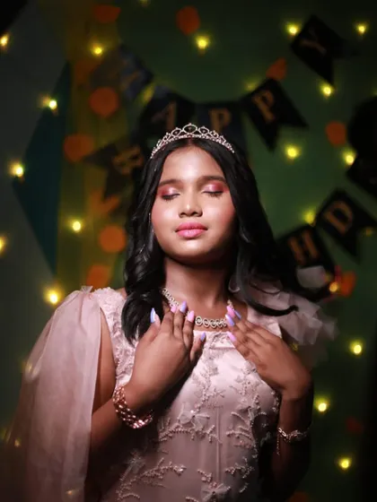 A dramatic shot of the birthday girl, feeling her princess moment.