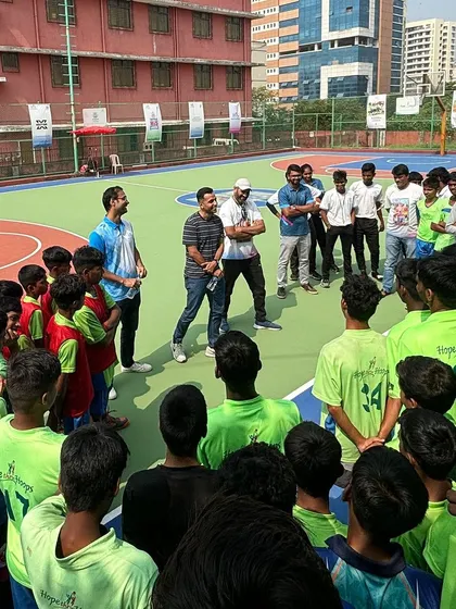 Mr. Darshan addresses the young basketball players. Sharing words of wisdom and encouragement is a small but important part of our collaborative efforts to inspire the next generation.