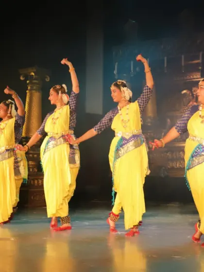 A full gallery from a special performance in my hometown after 25 years, showcasing a full group of dancers on a professionally lit stage.