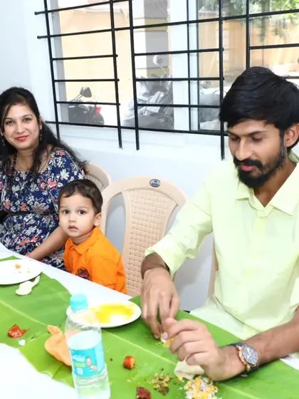 A family with a young child enjoying our food. We love catering for family events and making them special.