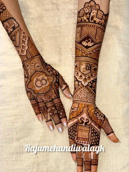This bridal mehandi is full of symbolic details. It features swans and elephants, representing grace and strength, along with a central motif of interlocking wedding rings to celebrate the union.