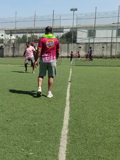 A coach oversees a casual game during the RSA Community Fest. It's a day for relaxed play and celebrating our shared passion for football.