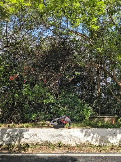 Ashtavakrasana (Eight-Angle Pose) on a roadside ledge. Finding opportunities to practice in unexpected places keeps the journey interesting and reminds me that yoga can be done anywhere.
