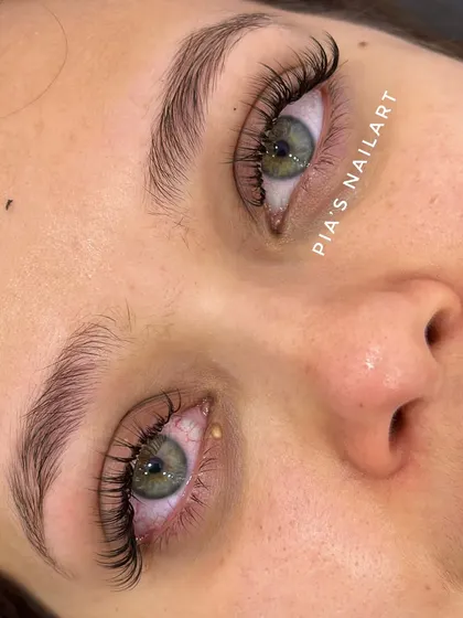 These lash extensions look extra stunning against the client's beautiful green eyes. The right lash style can really make your natural eye color stand out. I love customizing sets to enhance each client's unique beauty.
