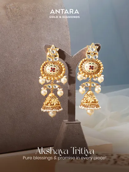 Jhumkas that sway with the strength of tradition and the grace of modern elegance. These matte gold jhumkas with meenakari details are perfect for Akshaya Tritiya.