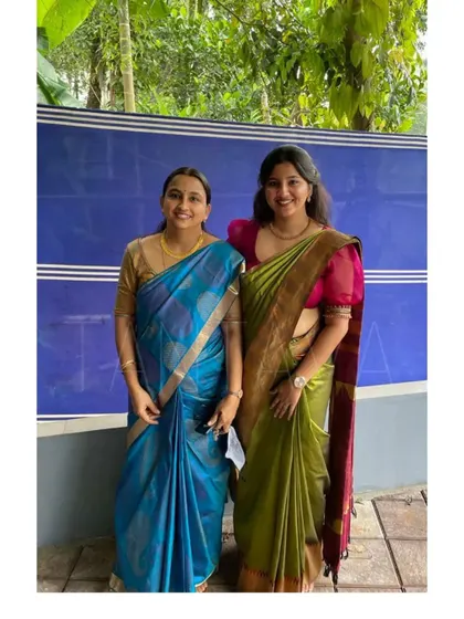 Twinning in style. This mother and daughter are wearing custom blouses I designed to match their beautiful silk sarees for a family function.