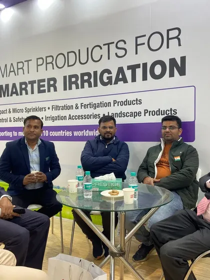 A candid shot of a meeting at our PlastIndia booth. We foster an environment of open conversation to build lasting business relationships.