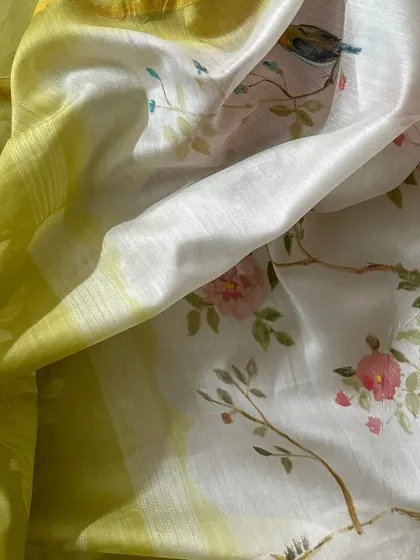 A close-up of the hand-painted dupatta, revealing the delicate brushstrokes and charming details of the floral and bird motifs.