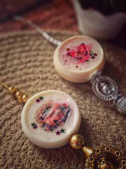 Two of my decorative wax sachets, showing different latkan designs. They provide a long-lasting fragrance for up to four weeks or more.