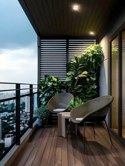 A minimalist balcony design with a stunning city view. The space is furnished with modern wicker chairs and a small table, perfect for enjoying a quiet evening outdoors.