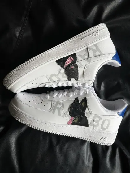 A pair shot of the Rambo custom sneakers, showing two different portraits of the same dog.